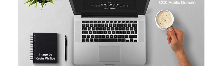 Laptop open on a desktop - Image by Kevin Phillips (CC0 Public Domain)